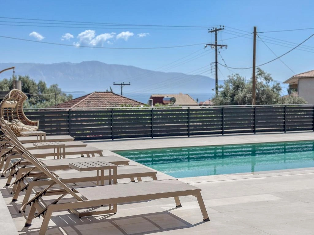 Zen Blu Boutique & Suites outdoor pool area with sea view