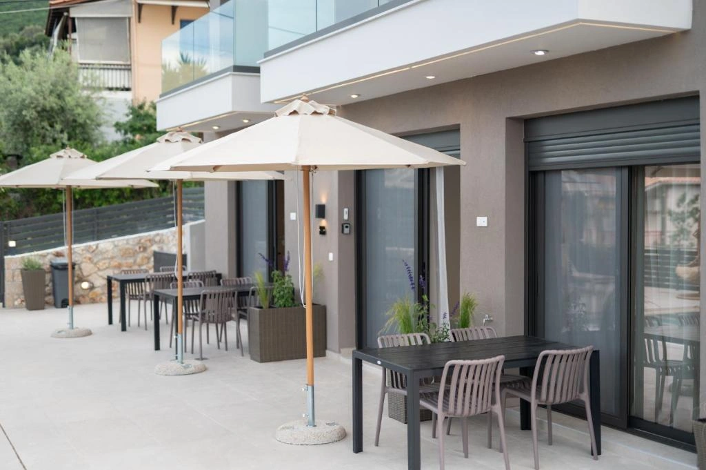 Premium sunbeds and umbrellas by the infinity pool